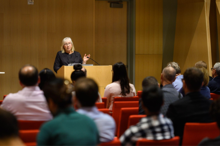 Benson speaks to an audience