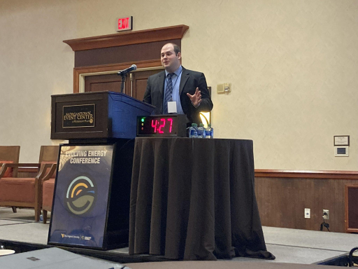 Matt Guttenberg speaks at a podium