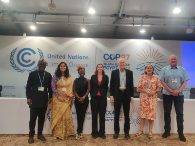 Seven people posed for a picture at COP27.