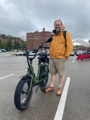 Paul Salvador next to his RadRunner 2 Electric Utility Bike.
