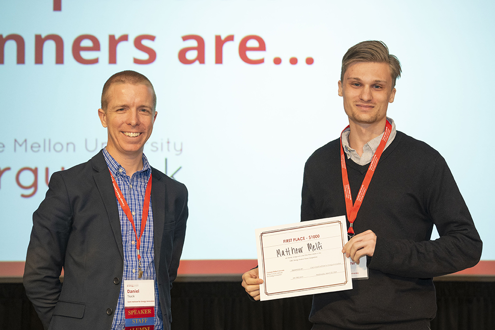 Matthew Melfi win first prize in poster competition