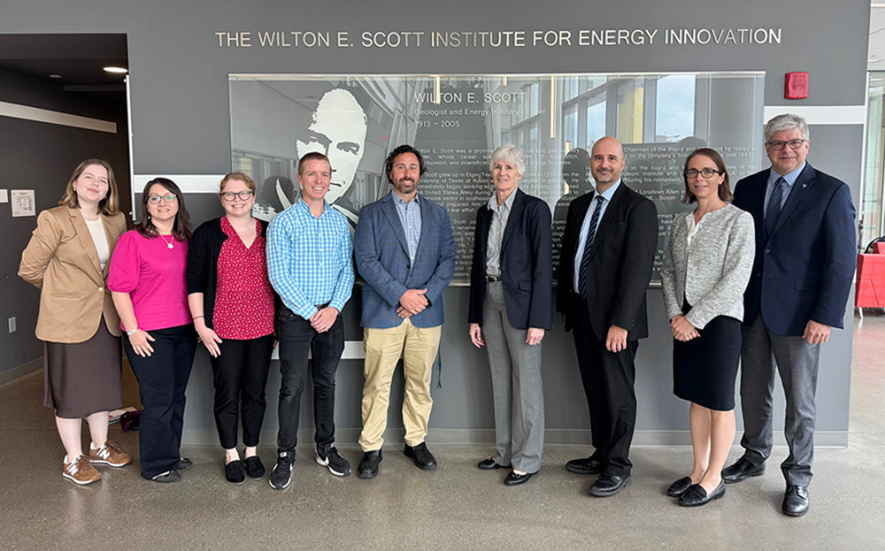 Marianne Walck poses for photo with Scott Institute faculty and staff